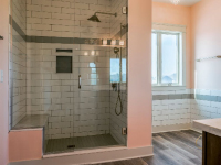 bathroom with large tile shower