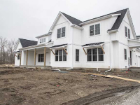front of custom home with white shingles