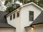 exterior of custom home with white siding exterior