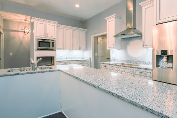 white kitchen cabinets with granite counter top